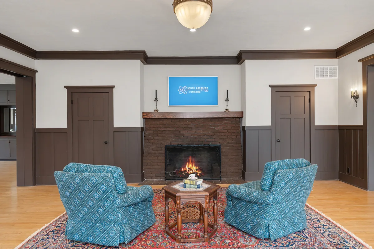The Clubhouse fireplace lounge, a quiet seating area off the main hall