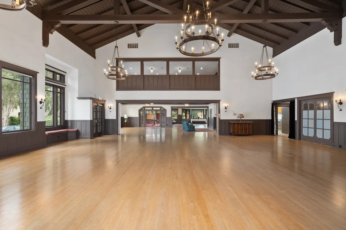 The Clubhouse ballroom with an open dance floor, set for a reception